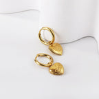 Boucles d'oreilles rondes en forme de cœur avec motif œil