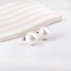 Platte witte parel oorbellen