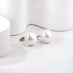 Platte witte parel oorbellen