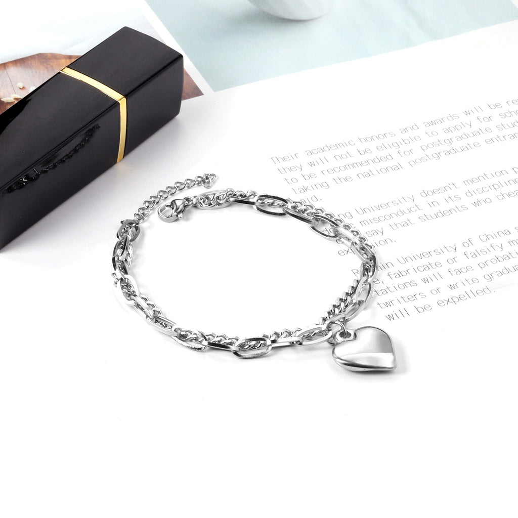 Bracelet réglable avec breloque en forme de cœur