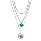 Drievoudige ketting met groen hart en roze zirkonia bedeltjes