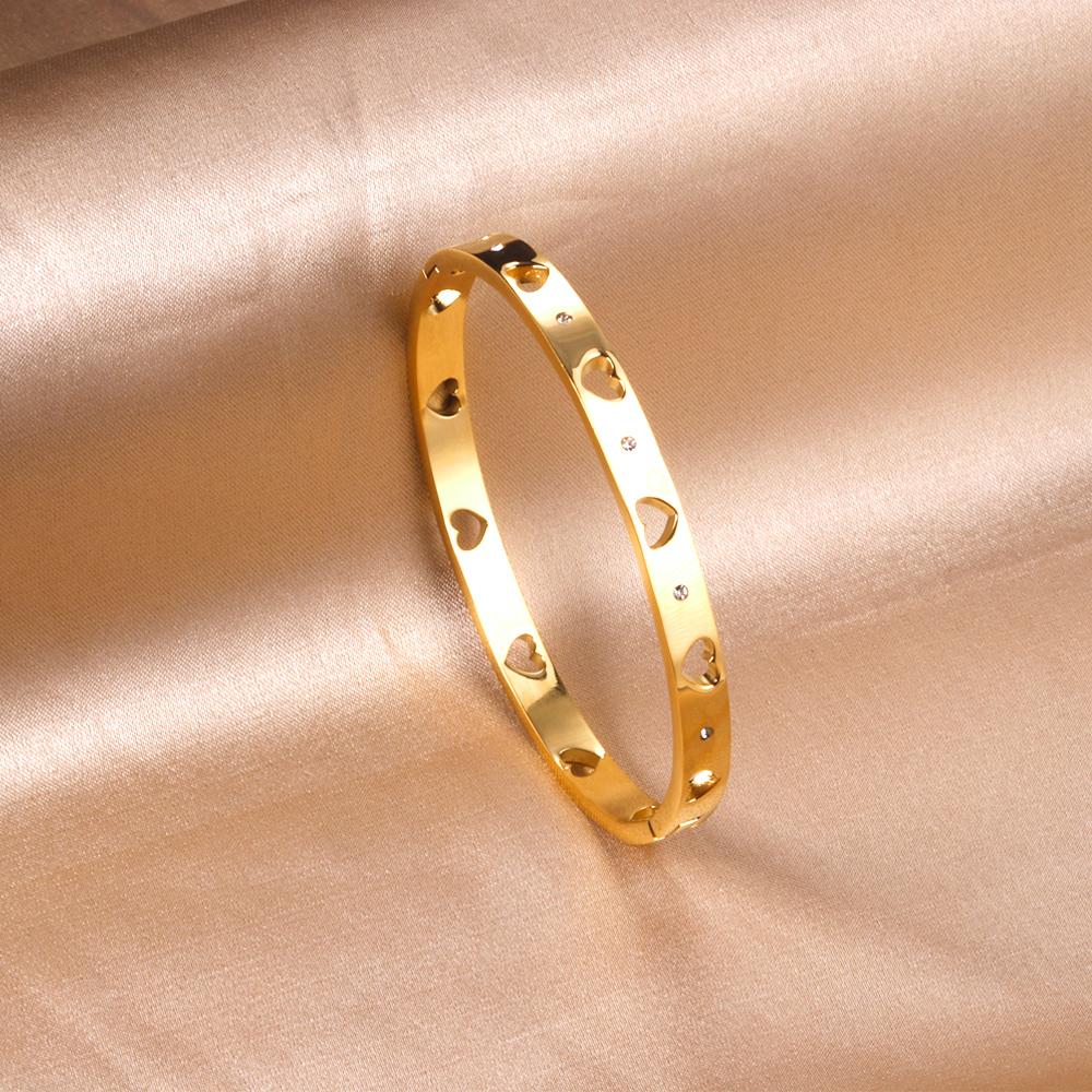 Armband met gouden hartpatroon en kubieke zirkonia