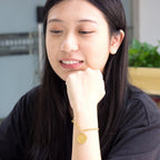 Dikke armband met gouden hartbedel 