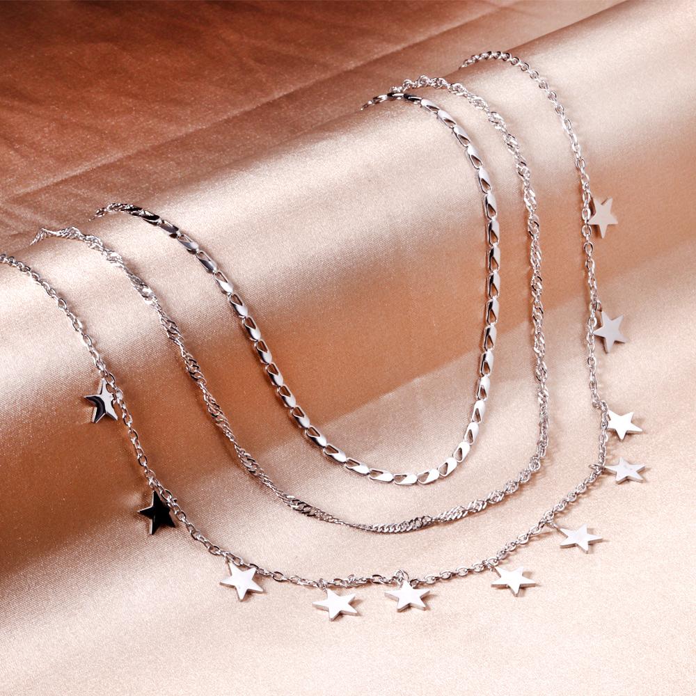 Drievoudige ketting met sterbedels 