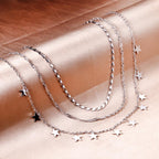 Drievoudige ketting met sterbedels 