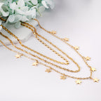 Drievoudige ketting met sterbedels 