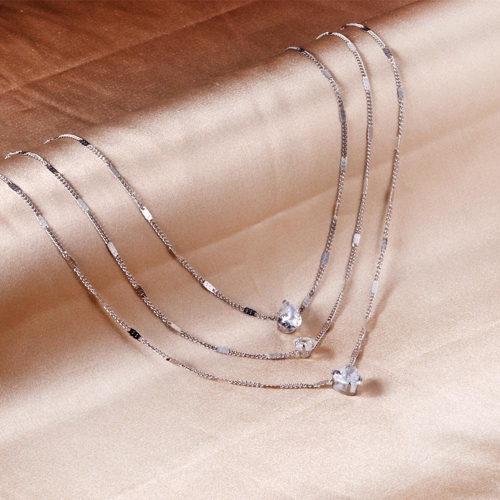 Drievoudige ketting met hartvormige hanger 