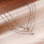 Drievoudige ketting met hartvormige hanger 