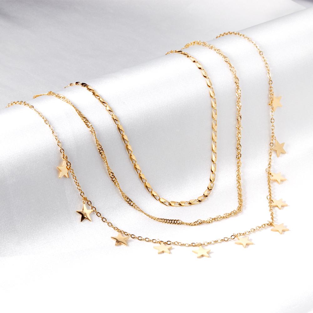 Drievoudige ketting met sterbedels 