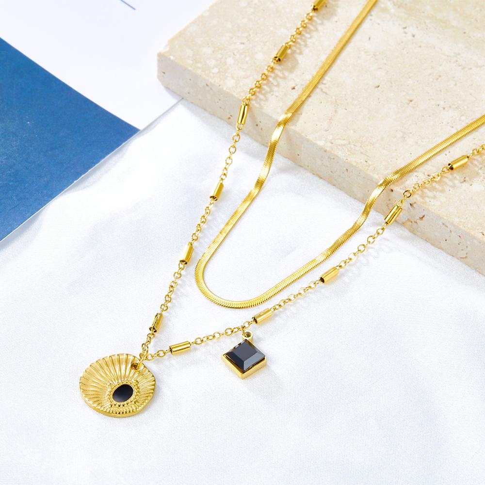 Dubbele laag schelp en zwarte druppelolie ketting